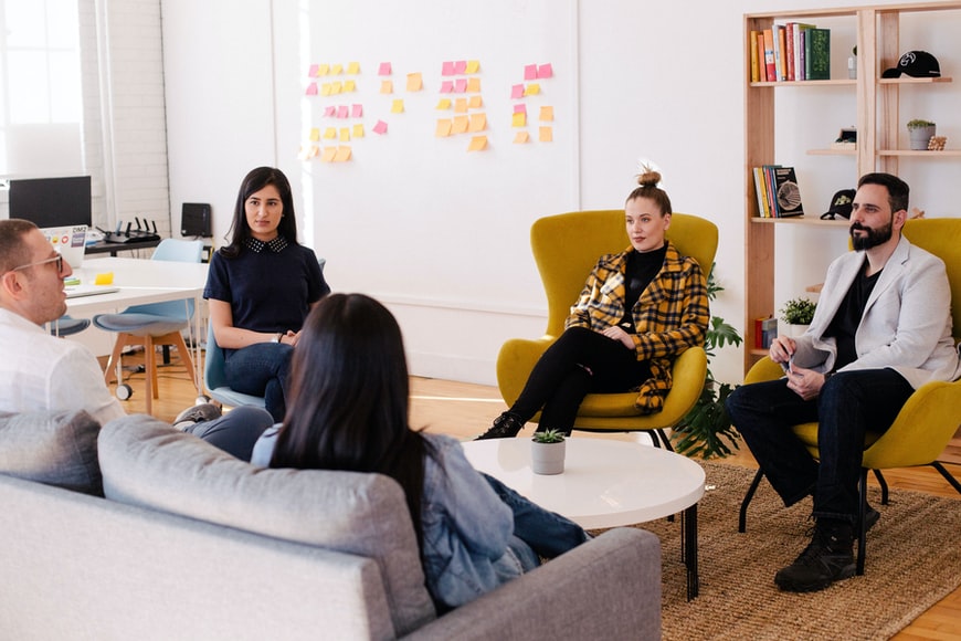 co-workers discussing in an office