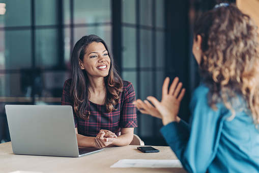 a recruiter interviewing an applicant